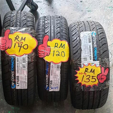 tayar axia harga